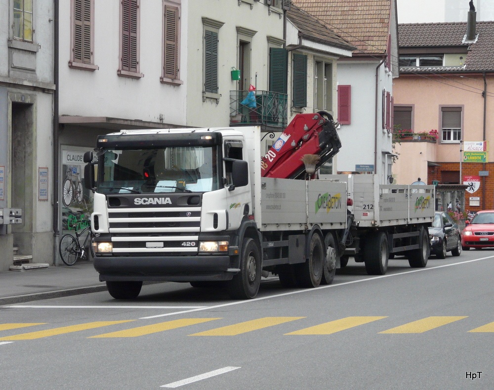 Scania 420 mi Pritsche und Anhnger unterwegs in Biel am 04.09.2012