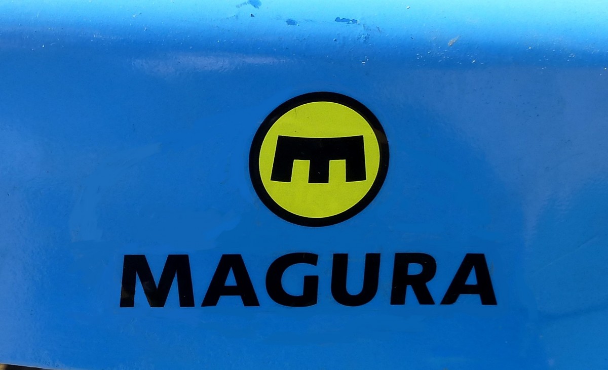 MAGURA, steht fr Gustav Magenwirth GmbH&Co.KG, die Firma in Bad Urach baut Komponenten fr den Motor-und Fahrzeugbau, dieses Logo wurde bis 2010 ververwendet, Dez.2015