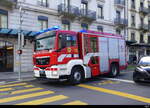 MAN Feuerwehr unterwegs mit Blaulicht in den Strassen der Stadt Genf am 24.03.2024