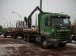 Am 19.Januar 2010 brachte Dieser Scania Holztransporter Holz zur Verladung auf dem Bahnhof in Bergen/Rgen.
