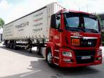 MAN TGS18.400 Trucknology-Roadshow; bei der Vorfhrung eines Trimoder-System Aufliegers anlsslich der Transport-Logistic2013 in Mnchen; 130607