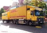 MB Actros 2541 der Spedition Krger & Voigt, beladen mit DHL-Container, Rostock 19.9.2012
