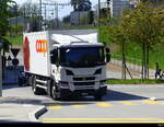 Scania mit Kastenaufbau unterwegs in den Strassen der Stadt Nyon am 06.04.2024