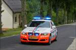 . BMW der Luxemburgischen Polizei mit Blaulicht als Vorhut Fahrzeug eines Radrennens am 07.06.2014.
