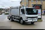 Mitsubishi Fuso eCanter Müllwagen unterwegs in der Stadt Lausanne am 24.01.2026