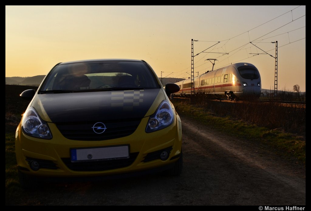 Zwei der grten Verkehrskonkurenten: Die Bahn und das Auto. Hier zu sehen ein Opel Corsa Color Race und ein ICE der Baureihe 411 bei Wettelsheim (nhe Treuchtlingen) am 20. Mrz 2012.