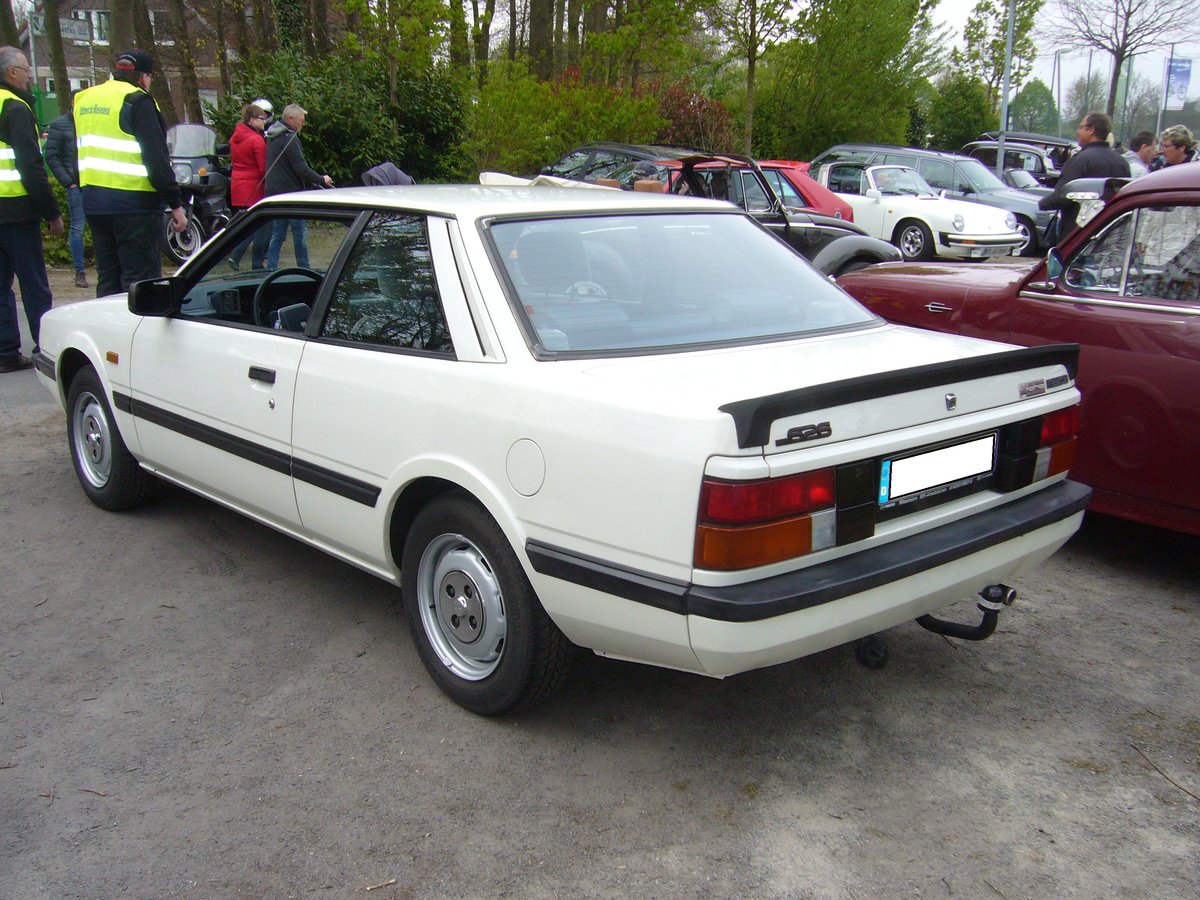 Heckansicht eines Mazda 626 Coupe (Baureihe GC). 1983 - 1987. Oldtimertreffen Hörstel-Riesenbeck am 01.05.2017.