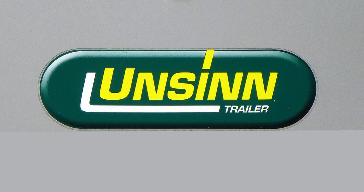 UNSINN GmbH, Firmenschild an einem LKW-Anhnger, die Nutzfahrzeugfirma wurde 1958 in Bayern gegrndet, Sept.2017