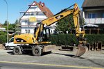 =CAT M316D steht auf einer Baustelle in Fulda, August 2016
