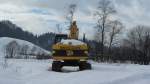 JCB Bagger, bereits den ganzen Winter abgestellt, in Kramsach am 22.1.2012.
