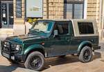 Dunkelgrüner Suzuki Samurai Santana, gesehen in August, 2025.