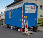 =Bauwagen des Bauunternehmens HODES steht im April 2023 in Petersberg-Marbach