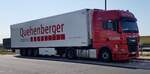=MAN-Sattelzug von QUEHENBERGER-Logistics steht auf einem Rastplatz an der A 3, Juli 2022