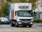 Mercedes Atego Kühltransporter unterwegs in der Stadt Lausanne am 09.09.2010