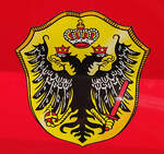 =Stadtwappen von ERLENBACH, angebracht am Ford Transit der Feuerwehr, gesehen auf auf dem Parkplatz der 2025er Rettmobil in Fulda