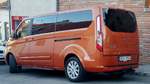 Ford Tourneo Custom in orange.