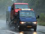 Iveco Daily mit Sattelauflieger transportiert einen Mercedes Sprinter am 11.09.2012 auf der A4 kurz vor der Niederländischen Grenze.