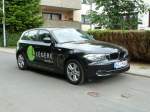 BMW als Werbeträger für ein Hotel, gesehen in Taunusstein, Juni 2010
