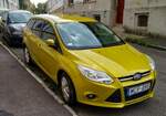 Ford Focus Turnier, in  Mustard Olive  (dritte Generation).