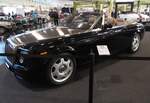 Profilansicht eines Rolls Royce Phantom VII Drophead Coupe aus dem Jahr 2008 im Farbton black mit einer Motorhaube aus geb�rstetem Edelstahl.