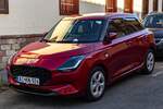 2024er Suzuki Swift in  Burning Red , gesehen in Juni, 2025.