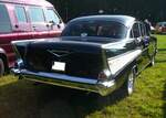 Heckansicht eines Chevrolet Series 2400C Bel Air fourdoor Sedan im Farbton onyxblack aus dem Modelljahr 1957. Oldtimertreffen auf dem Gelände des Bikertreffs Mutter Vogel in Marl am 28.09.2025.