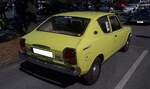 Heckansicht eines Datsun 100A der Baureihe E10 in der Karosserieversion zweit�rige Limousine im Farbton sonnengelb. Oldtimertreffen am 'Cafe del Sol' in Gelsenkirchen am 09.08.2026.