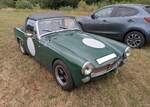Ein sportlich aufgemachter MG Midget MK3 im Farbton brooklands green, gebaut von 1966 bis 1974.
