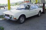 Am 26.07.2009 in der Auvergne in Frankreich. Eine eher unscheinbare Garage und Tankstelle, aber eine Menge Oldtimer zum Verkauf: u.a. dieser Peugeot 504 C12 von 1974