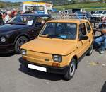 FSM  Polski Fiat  126p. Der Kleinwagen Fiat 126 kam 1972 als Nachfolger des legendären Fiat 500 auf den Markt. Bereits seit Juni 1973 wurde das Modell auch beim polnischen Hersteller FSM in Lizenz gefertigt. Anfangs aus importierten Teilen. Später wurde in der polnischen Stadt Tychy ein eigenes Werk für die Produktion, des in Polen  Maluch  (zu deutsch Knirps) genannten Wagens, gebaut. Bereits 1981 verließ der 1.000.000, in Polen produzierte 126p das Werk. Der im Heck verbaute, luftgekühlte, Zweizylinderreihenmotor hat einen Hubraum von 600 cm³ und leistet 23 PS. Die Höchstgeschwindigkeit des  Knirps  soll 110 km/h betragen. Classic car show at Chepstow race course/South Wales am 27. April 2025.