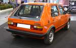 Heckansicht eines marsroten VW Golf 1 GTI aus dem Jahr 1983. Essen Motorshow am 06.12.2023.