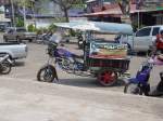 In Nong Khai im Norden Thailands sah ich im März 2010 dieses Motorradtaxi. Das Motorrad ist chinesischer Produktion eine APN oder eine LIFAN