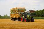 Claas Arion 650 mit Rundballenwagen am 13.07.26 bei Langenselbold