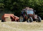 Fiat DT 8090 mit einer Welger Ballenpresse unterwegs, August 2009