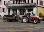 Steyr Traktor mit Mistwagen unterwegs in Schwyz am 27.02.2016