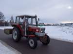 STEYR 8055 ist mit einer Ladeschaufel unterwegs;101222