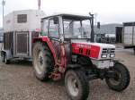 STEYR8055 mit Einachsanh�nger am Messegl�nde von Ried, im Hintergrund Fill-Metallbaustadion; 080429