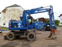 Komatsu PW 148-8 eingesetzt bei der Sanierung der Ortsdurchfahrt von Pellingen (10.06.2012)