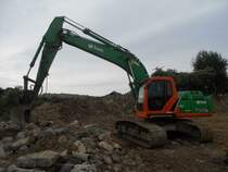 New Holland Kobelco E 215B auf einer Baustelle in der Nähe des Flughafens von Lüttich (B) am 14.06.2009
