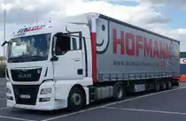 MAN TGX von  FITsped  steht abfahrbereit auf dem Rasthof Werneck, Juli 2015