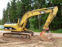 Caterpillar 318C L aufgenommen während der Bauarbeiten an der Umgehung von Merzig-Besseringen, 24.06.2012