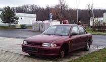Mitsubshi Lancer (1991-1995) fotografiert bei einer Tankstelle am 06.03.2016.