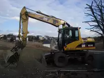 Caterpillar M 313C auf einer Baustelle bei Junglinster, 01.02.2009