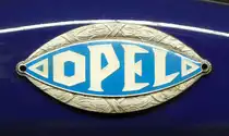 =Logo des Opel Blitz 1,5-29, Bj. 1939, 1488 ccm, 37 PS, gesehen im sächsischen Nutzfahrzeugmuseum in Hartmannsdorf im Juli 2016