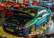 Renault MEgane I coupé in einer interessanten Farbe und mit viel Tuning. Foto: 25.03.2017, Automobil und tuning Show, Budapest.