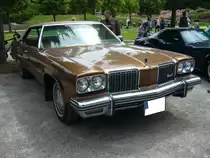 Oldsmobile 98 Luxury aus dem Modelljahr 1974 im Farbton ciation bronce. Oldtimertreffen Nordsternpark Gelsenkirchen am 24.06.2018.