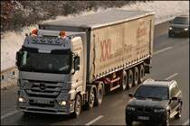Actros MP3 2555(?) V8 der Spedition BENDER ist bei L�denscheid unterwges. (12.02.2009)

