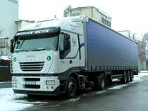 IVECO-STRALIS450 einer Polnischen Spedition steht am tr�ben Valentinsnachmittag vor dem Milchtrocknungswerk Ried i.I. und wartet mit eingeschaltener Standheizung auf seine Be/Entladung; 090214