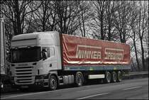 Scania Topline R420 mit einem Trailer der Iserlohner Spedition WINNER. (15.02.2009)
