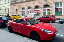 Roter Hyundai Coupé (oft auch als Tiburon genannt), fotografiert am 17.08.2018.